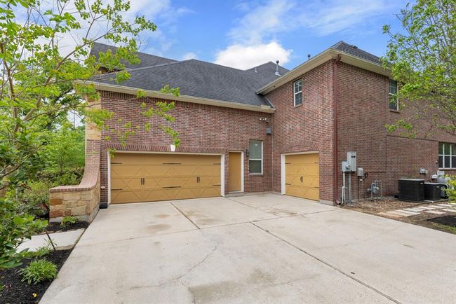 Two car garage with separate single car garage. | Image 36