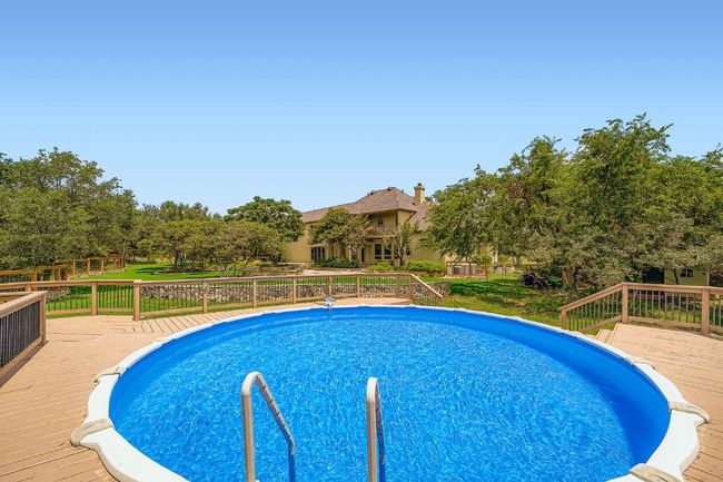 Pool has custom deck and cover; done right! | Image 29