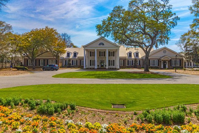 Neoclassical / greek revival house with a front lawn | Image 37