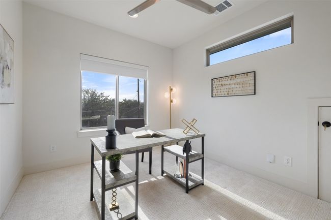 Office space featuring baseboards, visible vents, ceiling fan, and carpet flooring | Image 28