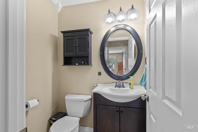 Half bath featuring vanity and ornamental molding | Image 20