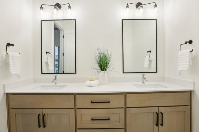 Dual vanities and timeless tile design bring elegance to everyday routines. | Image 28