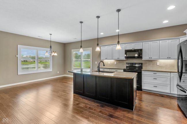 PLANTATION SHUTTERS ADORN ALL THE WINDOWS ON THE BACKSIDE OF THE HOME | Image 6