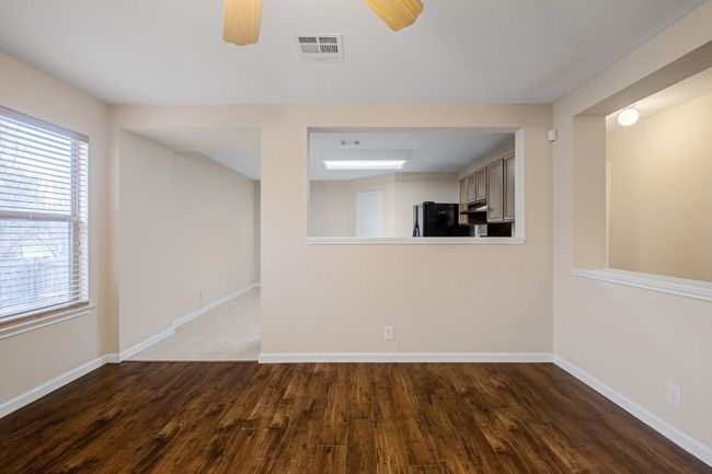 Unfurnished room with wood finished floors and ceiling fan | Image 4