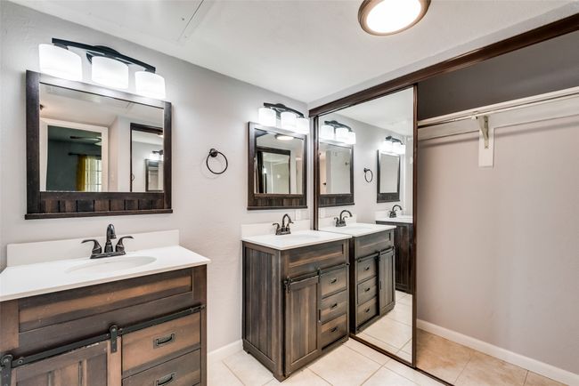 Full bathroom featuring double vanity and tile patterned flooring | Image 10