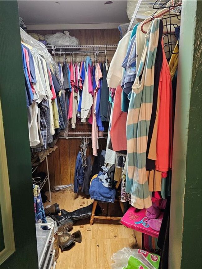 Walk in closet with wood finished floors | Image 8
