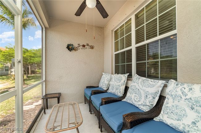 Sunroom / solarium with a ceiling fan | Image 15
