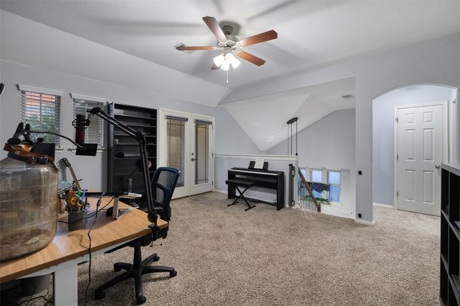Lofted second living upstairs has a private covered balcony and access to climate controlled server room. Extensive home automation includes lights, doors, shades and security cameras. | Image 17