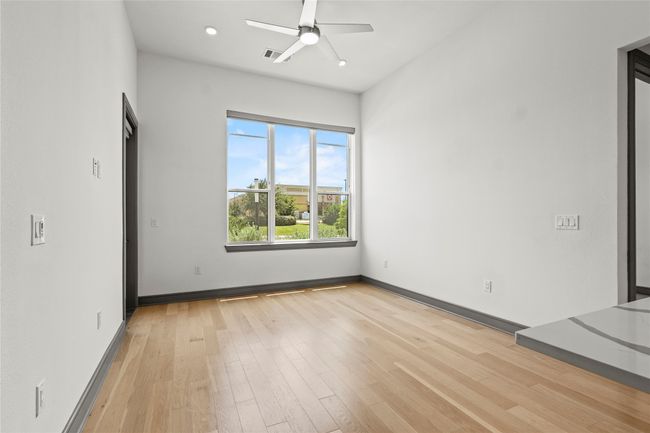 Spare room with a ceiling fan, light wood-style flooring, baseboards, and recessed lighting | Image 10
