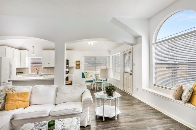 View from the living room looking into the kitchen. | Image 14