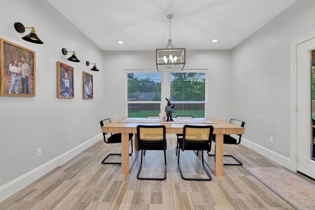 Bathed in natural light, the breakfast area overlooks the outdoor space and blends beautifully with the home’s open layout. | Image 20