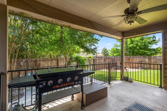 View of patio / terrace with a ceiling fan | Image 35