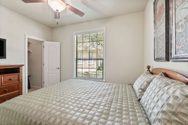 Bedroom featuring ceiling fan | Image 21