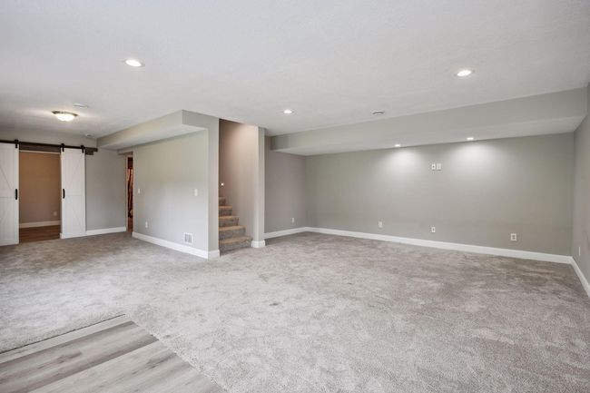 The walkout lower level has windows on two sides for lots of natural light | Image 24