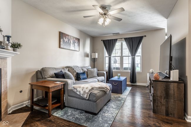 Family room is a great spot to relax and watch a movie. Lots of natural light and ceiling fan. | Image 5