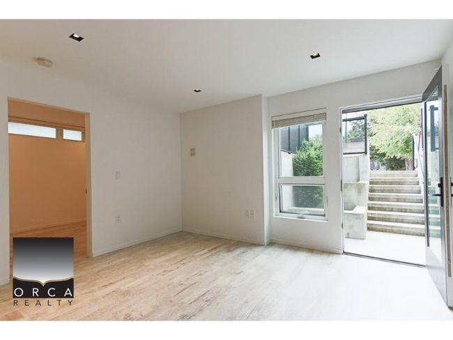 Spare room with plenty of natural light, wood finished floors, and a smoke detector | Image 7