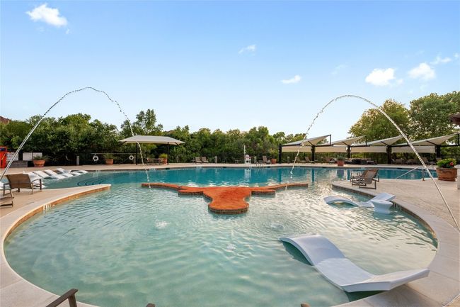 Community pool featuring a patio area | Image 20