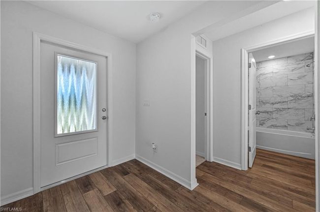 1403 Bush St W, House other with 3 bedrooms, 2 bathrooms and 2 parking in IMMOKALEE FL | Image 4