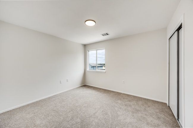 Unfurnished bedroom featuring carpet flooring, a closet, and baseboards | Image 26