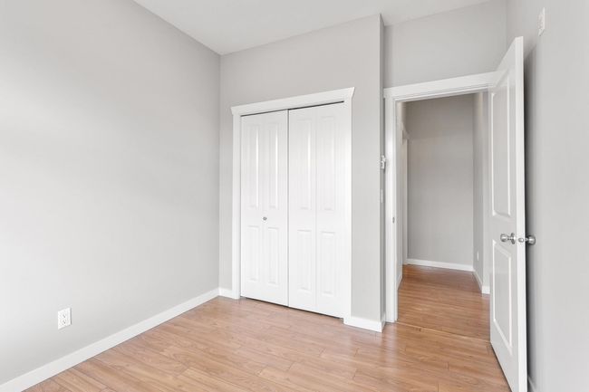 Unfurnished bedroom featuring baseboards, a closet, and light wood finished floors | Image 24