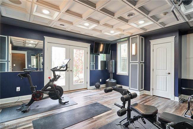 Exercise room with coffered ceiling, and french doors to patio and back yard | Image 39