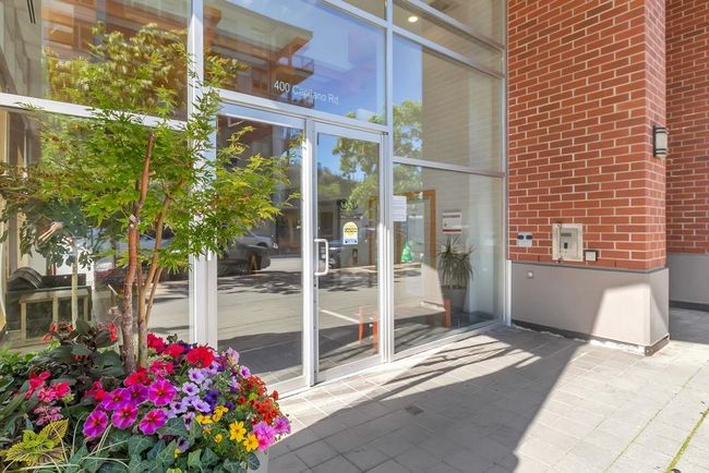 View of exterior entry featuring brick siding | Image 4