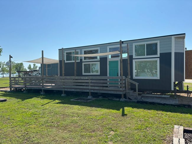 Rear view of property featuring a deck and a yard | Image 7
