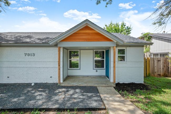 Ranch-style home featuring brick siding, covered porch, and roof with shingles | Image 4
