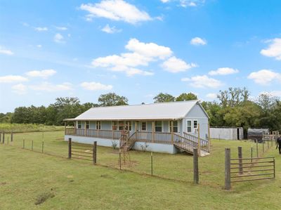 View of front of home with a rural view, a front yard, and an outbuilding | Image 2