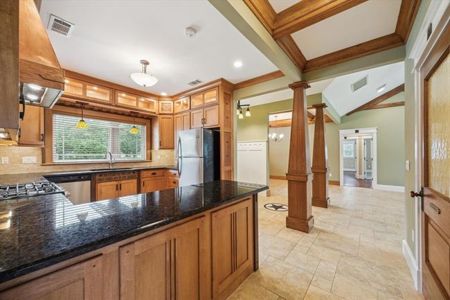 GRANITE ISLAND IS A CHEF'S DREAM! GORGEOUS POWDER ROOM IS TO THE RIGHT- NOTICE THE GORGEOUS CUSTOM WOOD DOOR! | Image 15