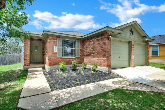 Front of the home to showcase clean and simple landscape. | Image 36