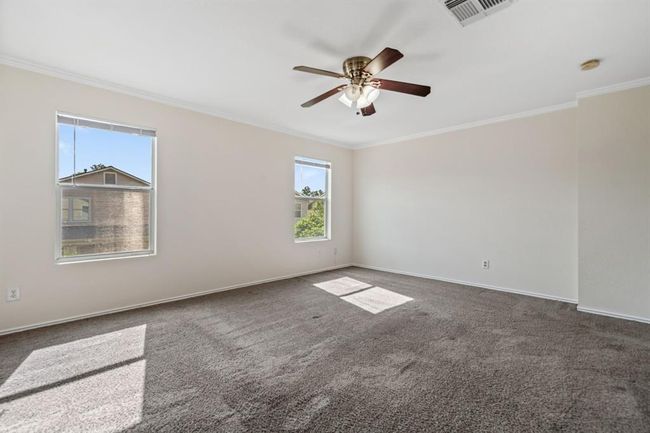 Another angle of the primary bedroom with great natural light. | Image 16