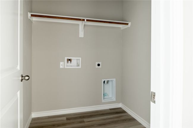 Clothes washing area with dark wood-type flooring, baseboards, washer hookup, laundry area, and electric dryer hookup | Image 20