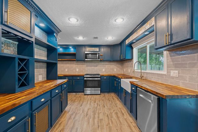 Kitchen with butcher block countertops | Image 14