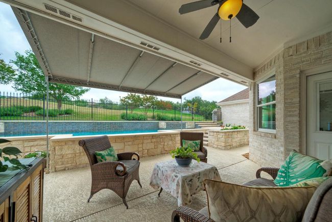 View of patio / terrace with visible vents, ceiling fan, a fenced backyard, and a fenced in pool | Image 32