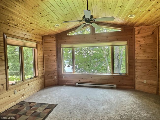 This may possibly be the favorite room in the house! Cozy, tongue and groove walls and vaulted ceiling offer an up north feel. | Image 31