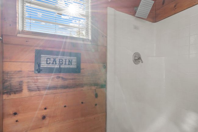 Full bathroom with a tile shower | Image 21