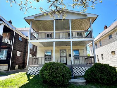 View of front of home with a balcony | Image 1