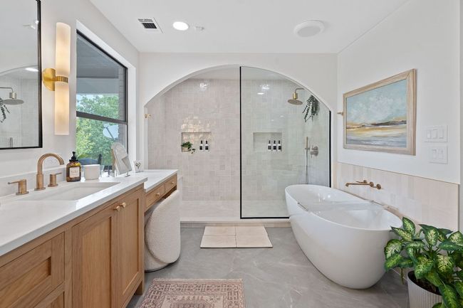 Newly remodeled spa-inspired bathroon with dual vanities separate makeup area | Image 19