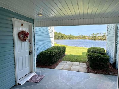 Property entrance with a yard and a water view | Image 2