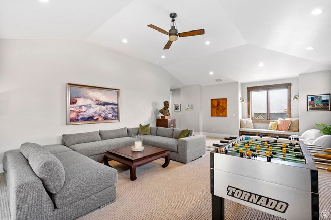 Playroom featuring recessed lighting, vaulted ceiling, and ceiling fan | Image 61