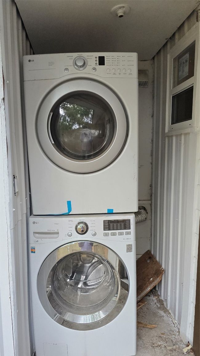 Laundry area with laundry area and stacked washer / dryer | Image 29