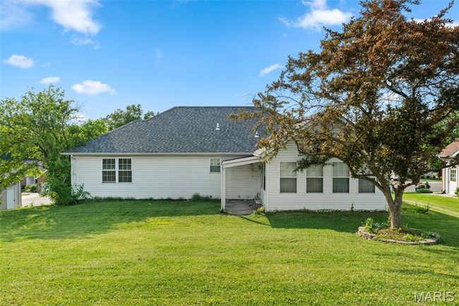 Back of property featuring a yard and a shingled roof | Image 28