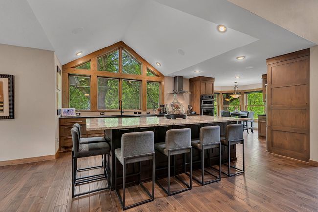 Expansive high top granite island | Image 5
