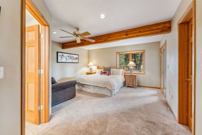 Lower level bedroom, with ensuite bathroom and steam shower | Image 39