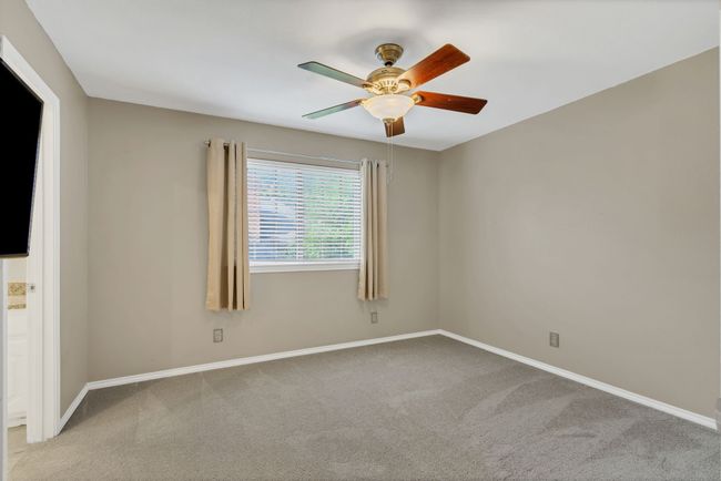 Spare room featuring carpet floors and a ceiling fan | Image 25