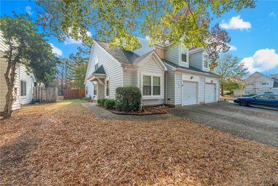 View of front facade with a garage | Image 1