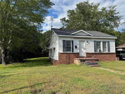 View of front of home with cooling unit and a front yard | Image 3