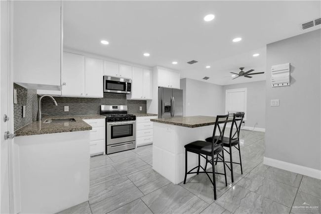 Other view of kitchen with plenty of storage space | Image 7