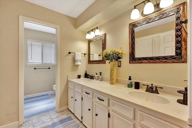 The upstairs secondary bath view. What you don't see in the photo is a wall of storage for your linens and bath goodies. Again, no shortage of storage in this home. | Image 35